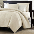 Ivory beige quilt coverlet with textured quilting and matching shams
