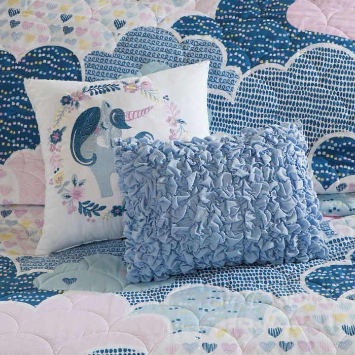Kids quilt coverlet with unicorn cloud pattern and blue ruffled accent pillow