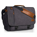 Gray canvas messenger bag front view with brown leather strap and flap closure