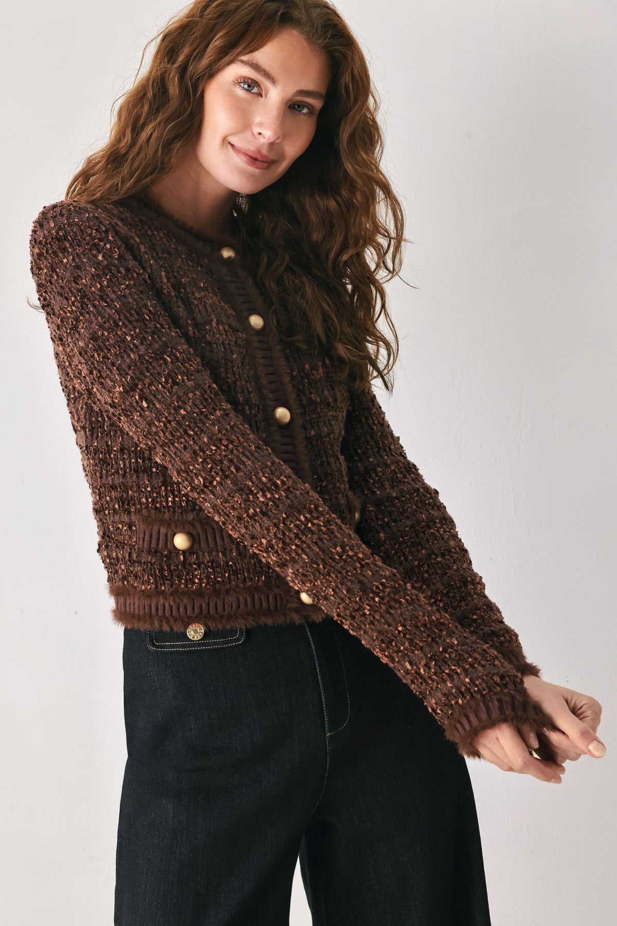 Brown cropped cardigan with button front and jewel buttons on textured knit