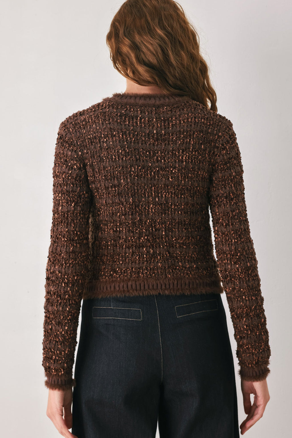 Brown cropped cardigan back view with textured knit and ribbed hem
