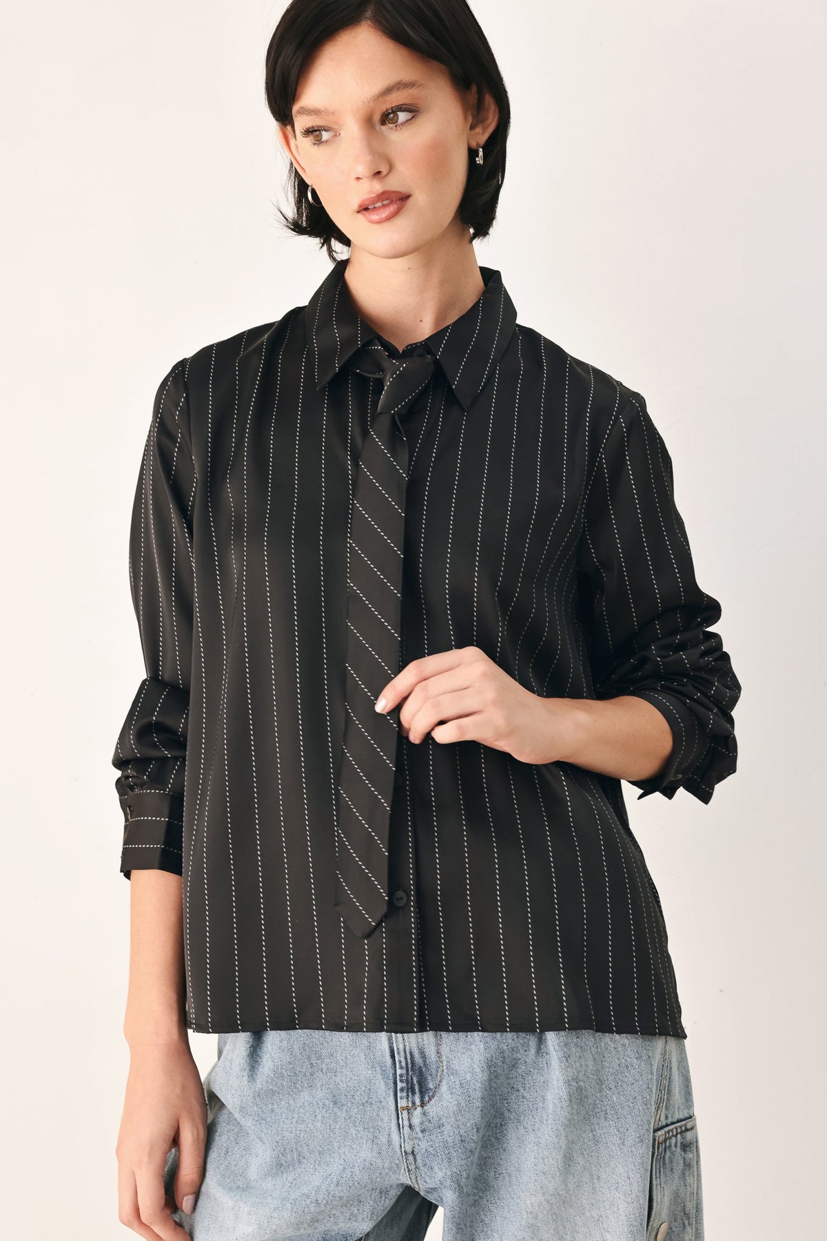 Black striped tie-front shirt top with long sleeves and button placket