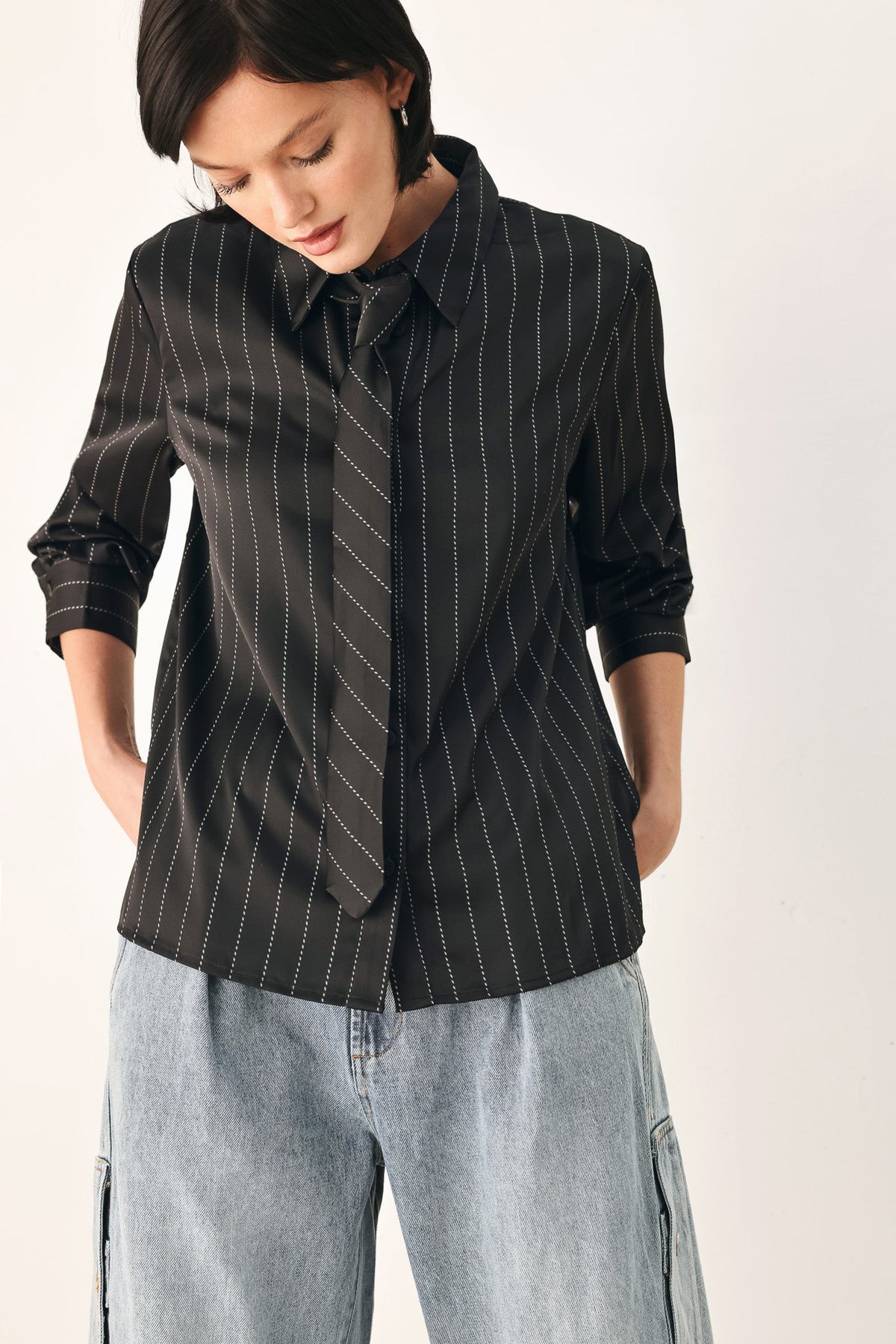 Black striped tie-front shirt top with ruched cuff sleeves and V tie