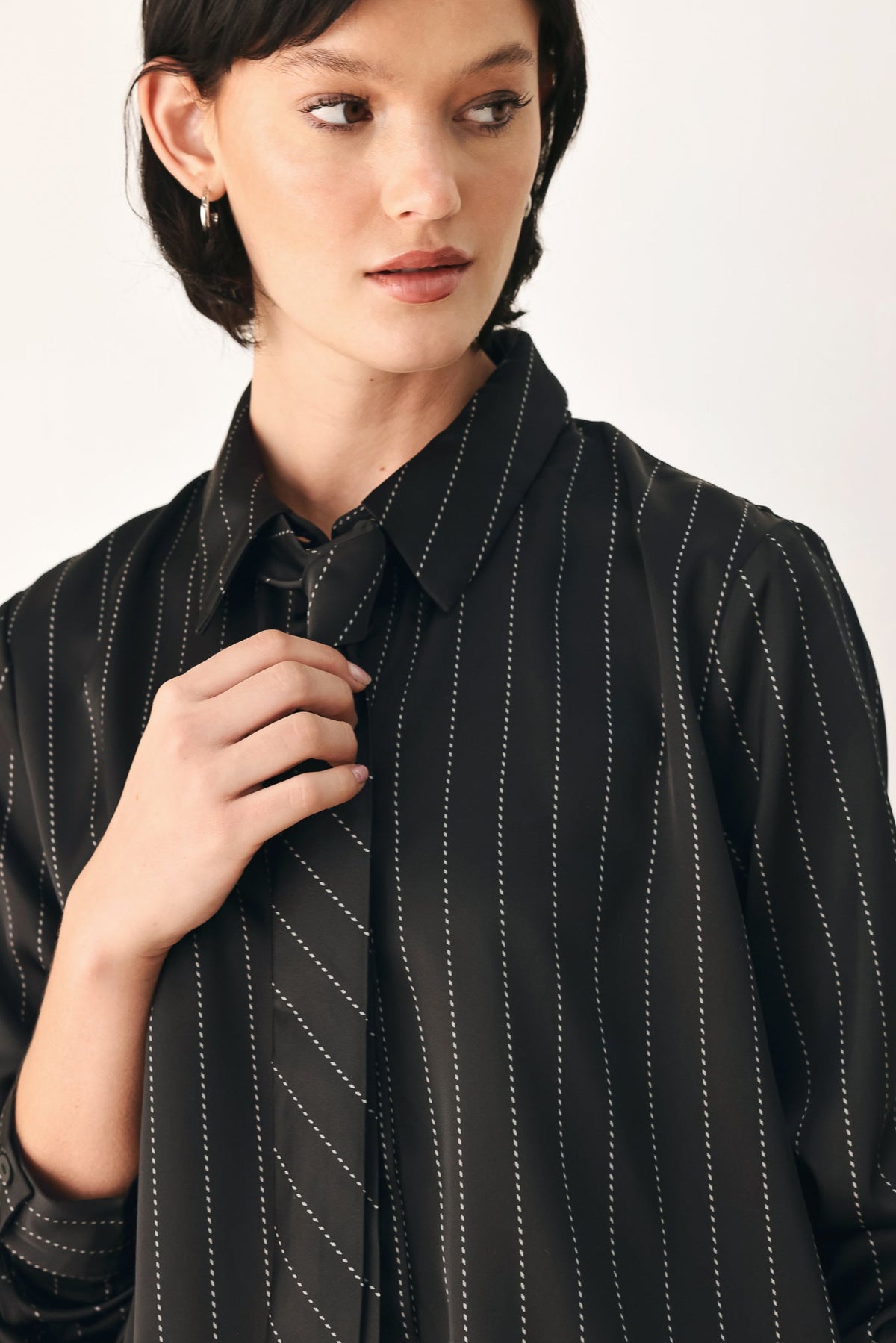 Black striped tie-front shirt top detail at collar and neck tie