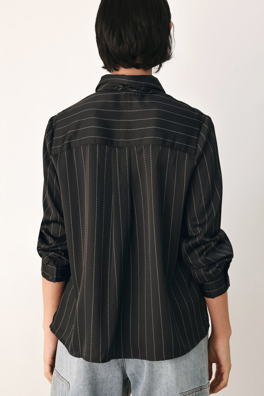 Black striped tie-front shirt top back view with vertical stripe pattern