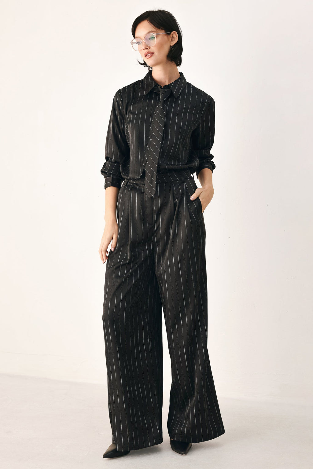 Black striped tie-front shirt top with V-neck tie and long sleeves