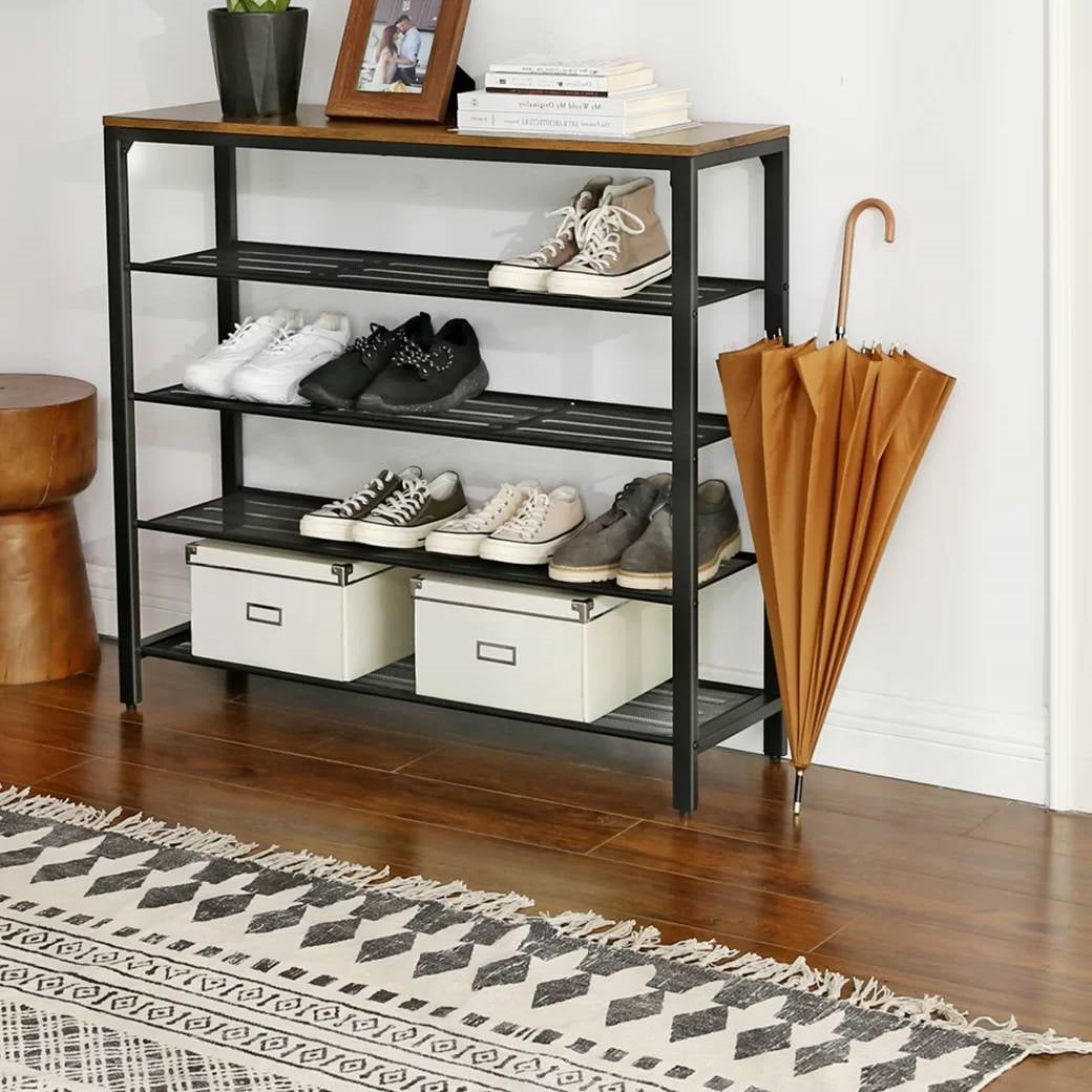 5-tier shoe rack with black metal frame, brown wood top, open shelves, drawer-style bins