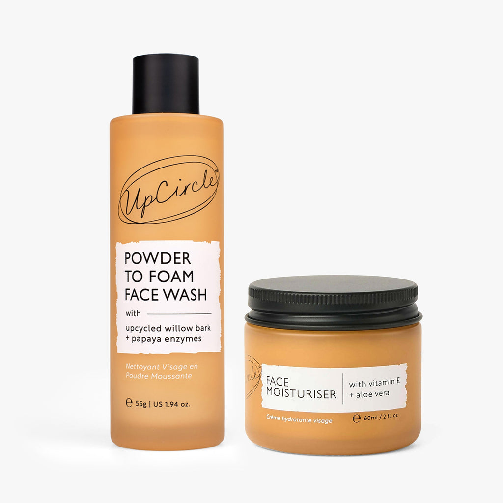 UpCircle powder-to-foam face wash bottle and vitamin E face moisturiser jar, amber