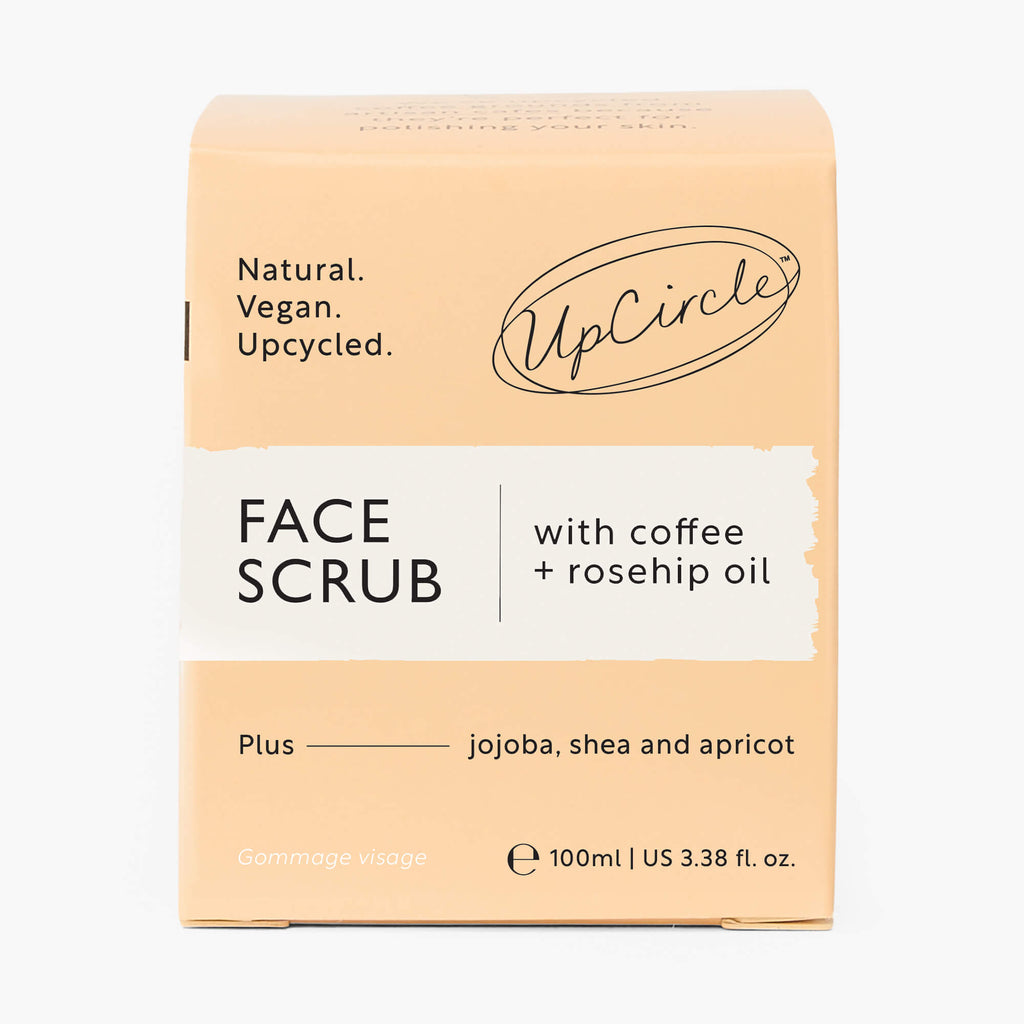 Face scrub box packaging, beige front with label text and coffee + rosehip oil
