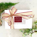 Hand care gift collection gift box with ribbon bow and holiday label