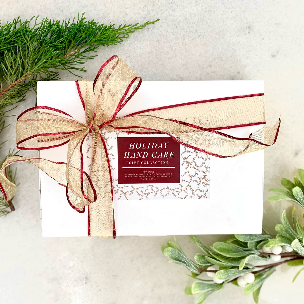Hand care gift collection gift box with ribbon bow and holiday label