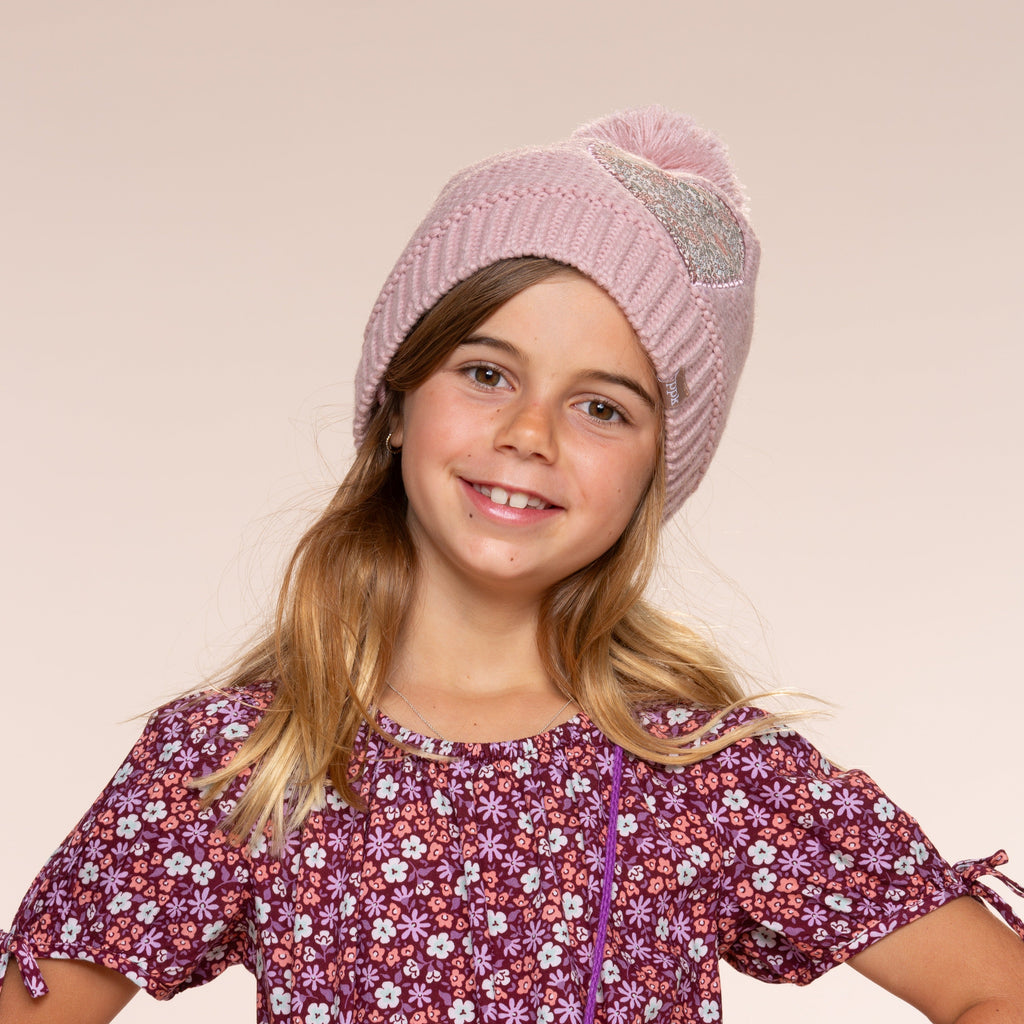 Mauve knit pom-pom beanie and floral heart patch with rabbit mittens on child