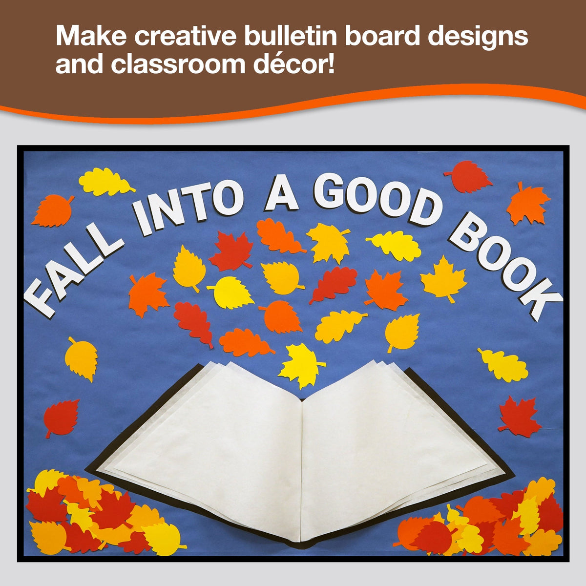 Fall leaf cutout decorations arranged around an open-book classroom display