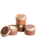 Four candle tins with lids: Pumpkin Clove, Spiced Cider, Roasted Cranberry, Autumn Leaves