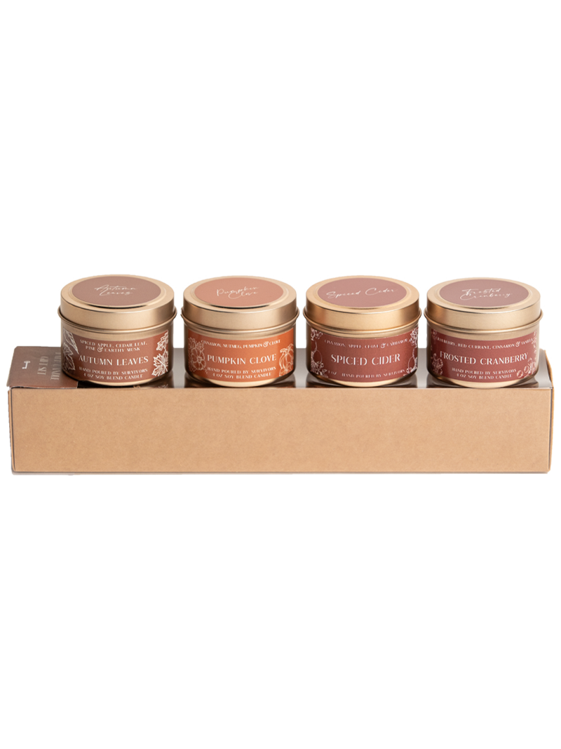 Four candle tins with metal lids: Autumn Leaves, Pumpkin Clove, Spiced Cider, Roasted Cranberry