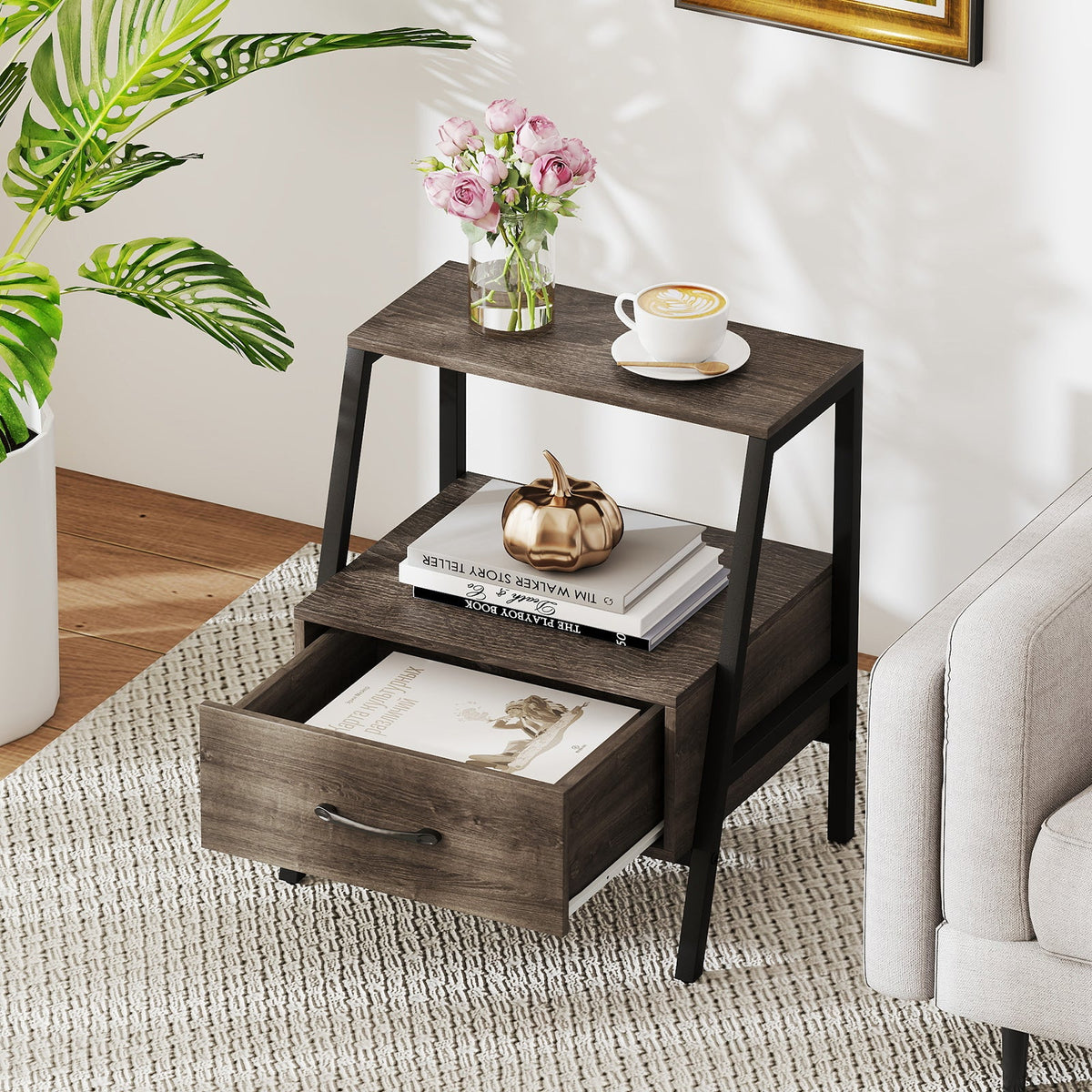 Dark wood side table with two open shelves and a front pull-out drawer
