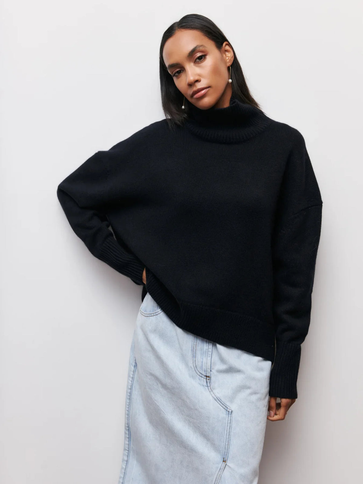Black chunky knit sweater with ribbed turtleneck and long sleeves