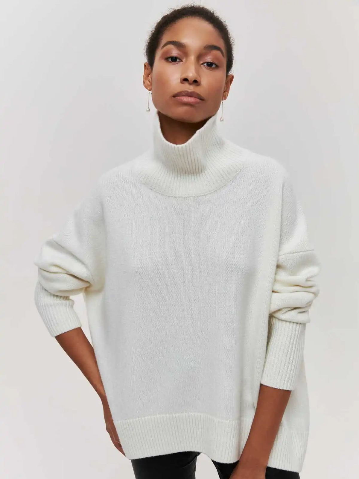 White chunky knit sweater with ribbed turtleneck and long sleeves