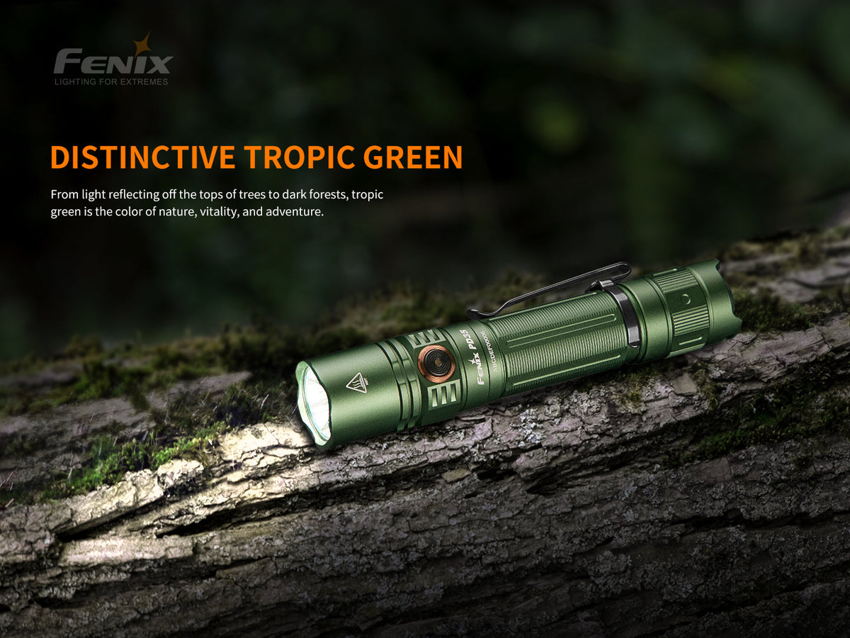Fenix PD35 V3.0 flashlight, Tropic Green, on outdoor rock, angled
