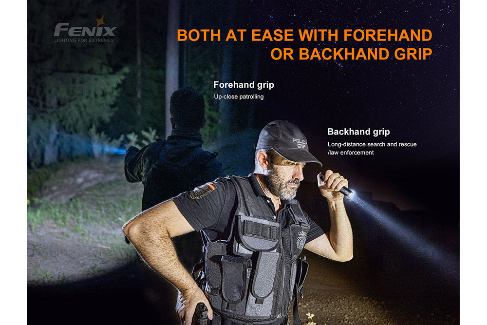 Fenix PD35 V3.0 flashlight held in forehand grip in low-light outdoors