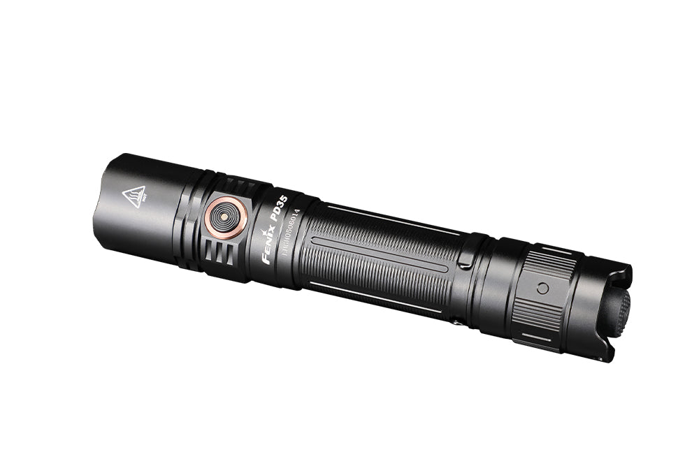 Black flashlight angled view with knurled body rings and side switch