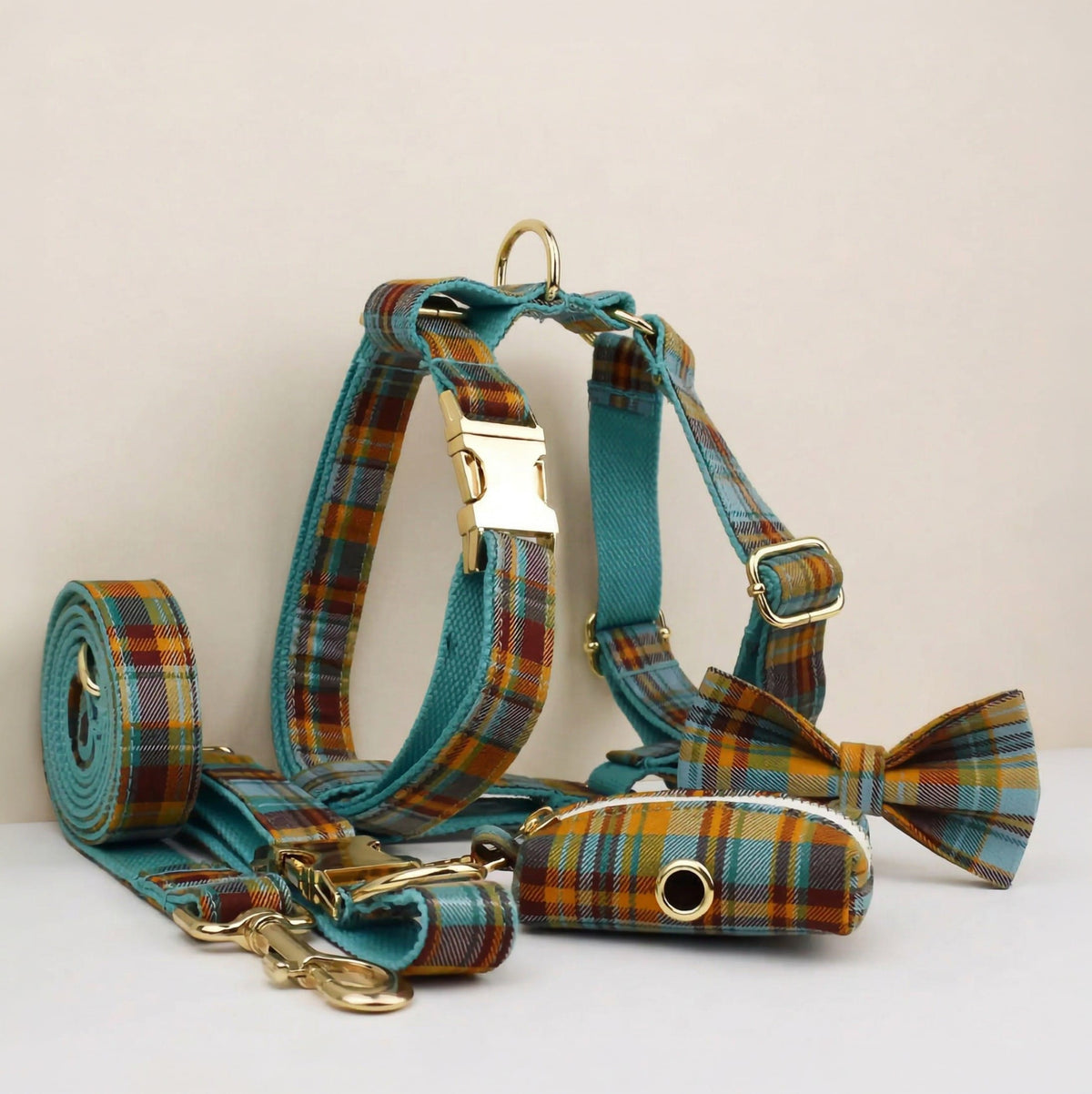 Teal and blue plaid dog collar, harness, leash, and bowtie set with gold hardware