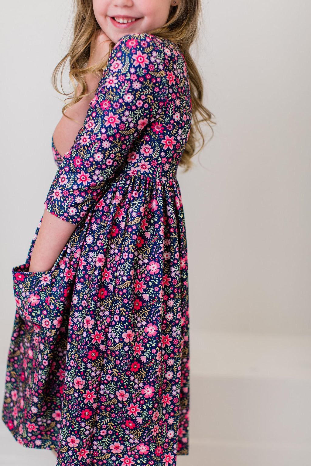 Floral twirl dress with 3/4 sleeves, navy with pink and white flower pattern