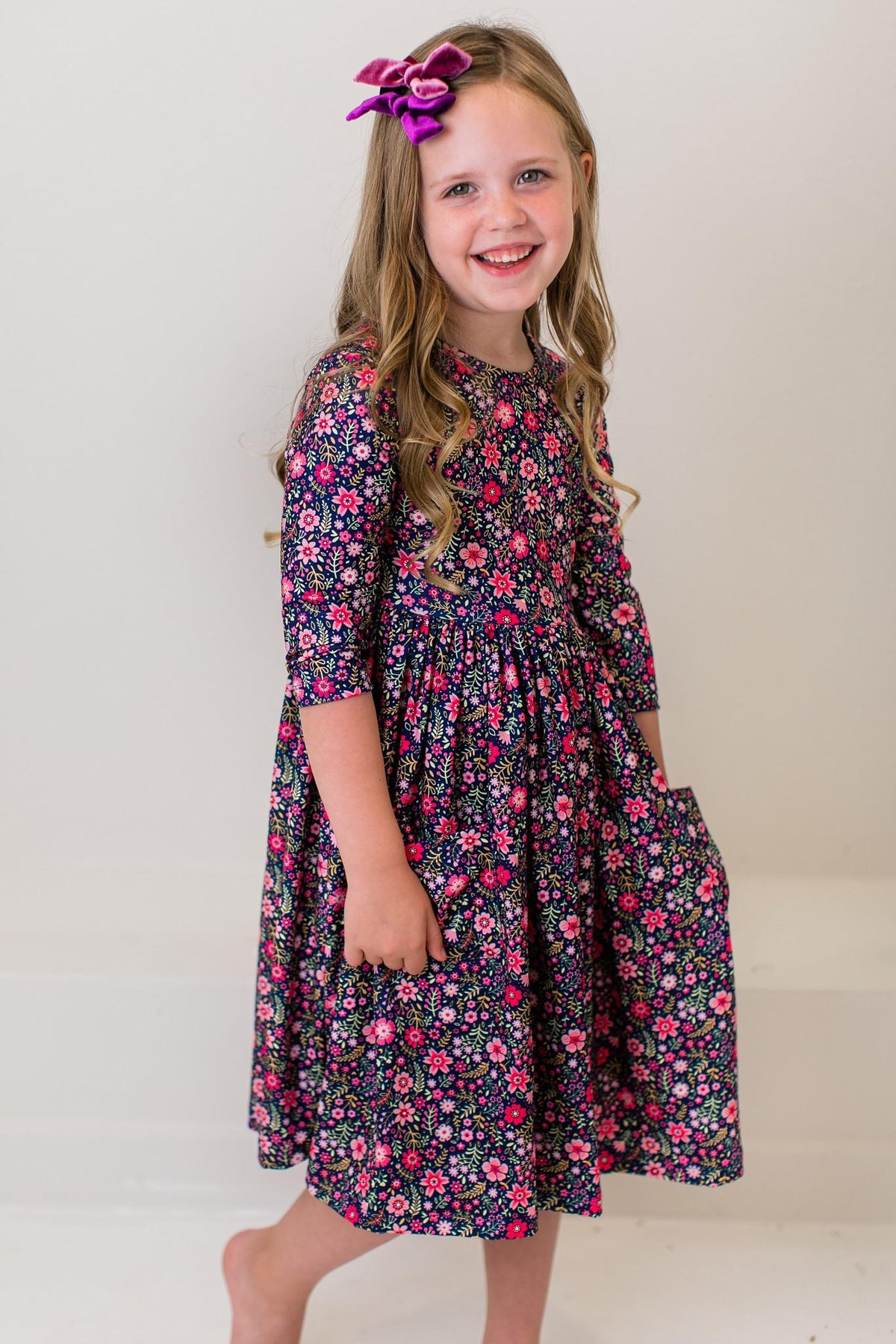 Floral twirl dress with 3/4 sleeves, navy floral print with gathered twirl skirt