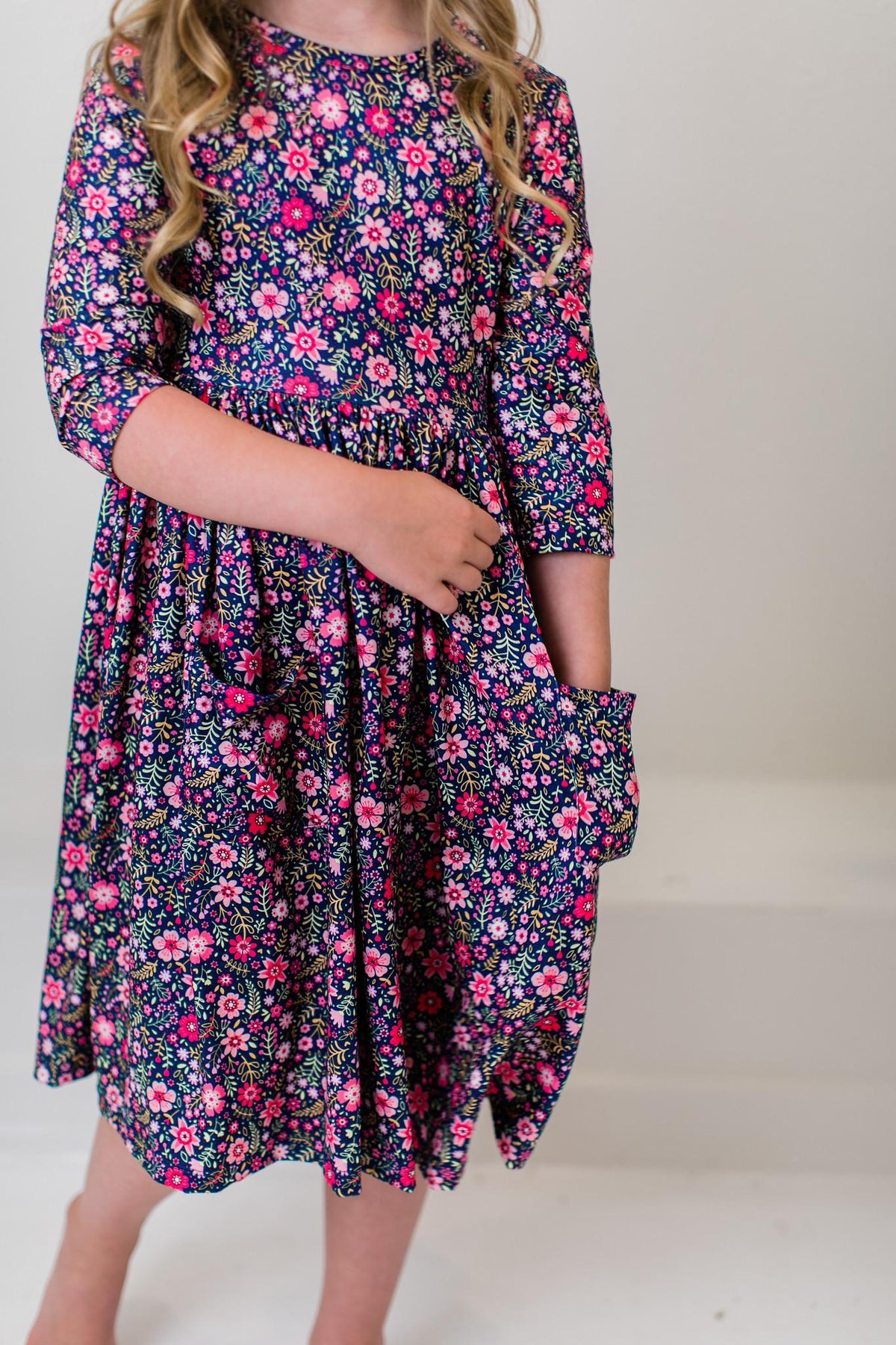 Floral twirl dress with side pockets and 3/4 sleeves, navy with pink and white flowers