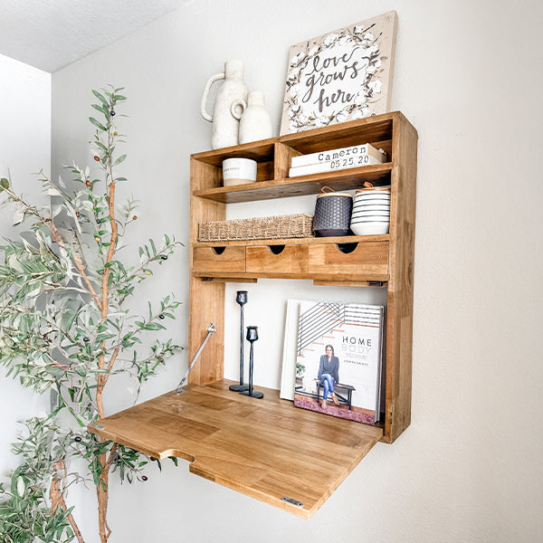 Fold-down wood shelf open like a wall desk with shelves and cubbies