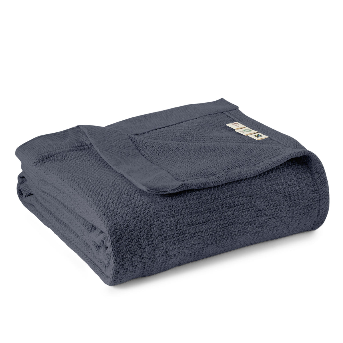 Dark blue woven blanket folded with textured weave and stitched edge.