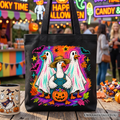 Black Halloween tote bag with colorful goose family graphic and teal pumpkin center.