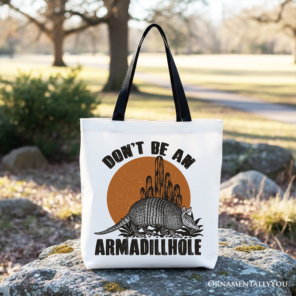 White canvas tote bag with armadillohole graphic and black top handles