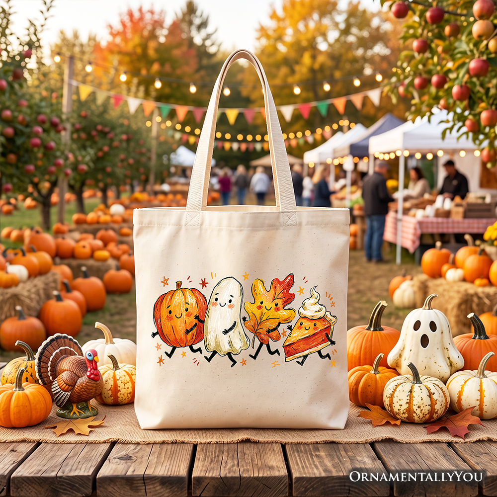 White canvas shopper tote bag with black handles and fall pumpkin ghost, leaf, pie artwork