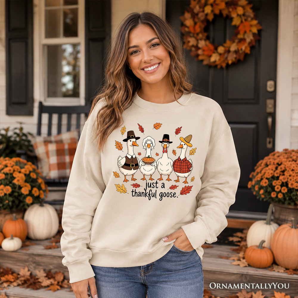 Cream crewneck sweatshirt with cute geese graphic and "just a thankful goose" text