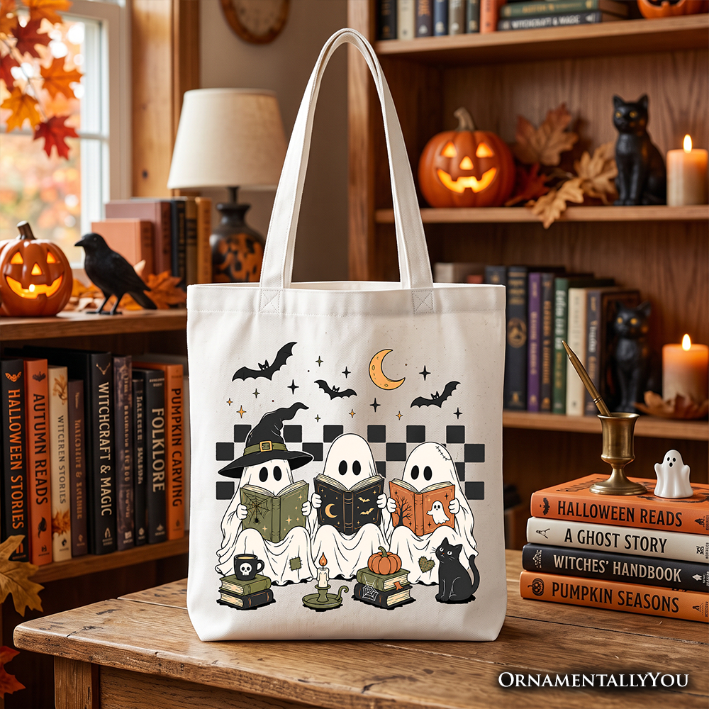 White tote bag with Halloween ghost, witch, and cat artwork, front view