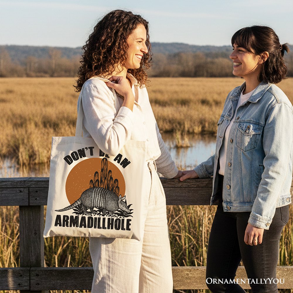 White canvas tote bag worn with armadillohole graphic