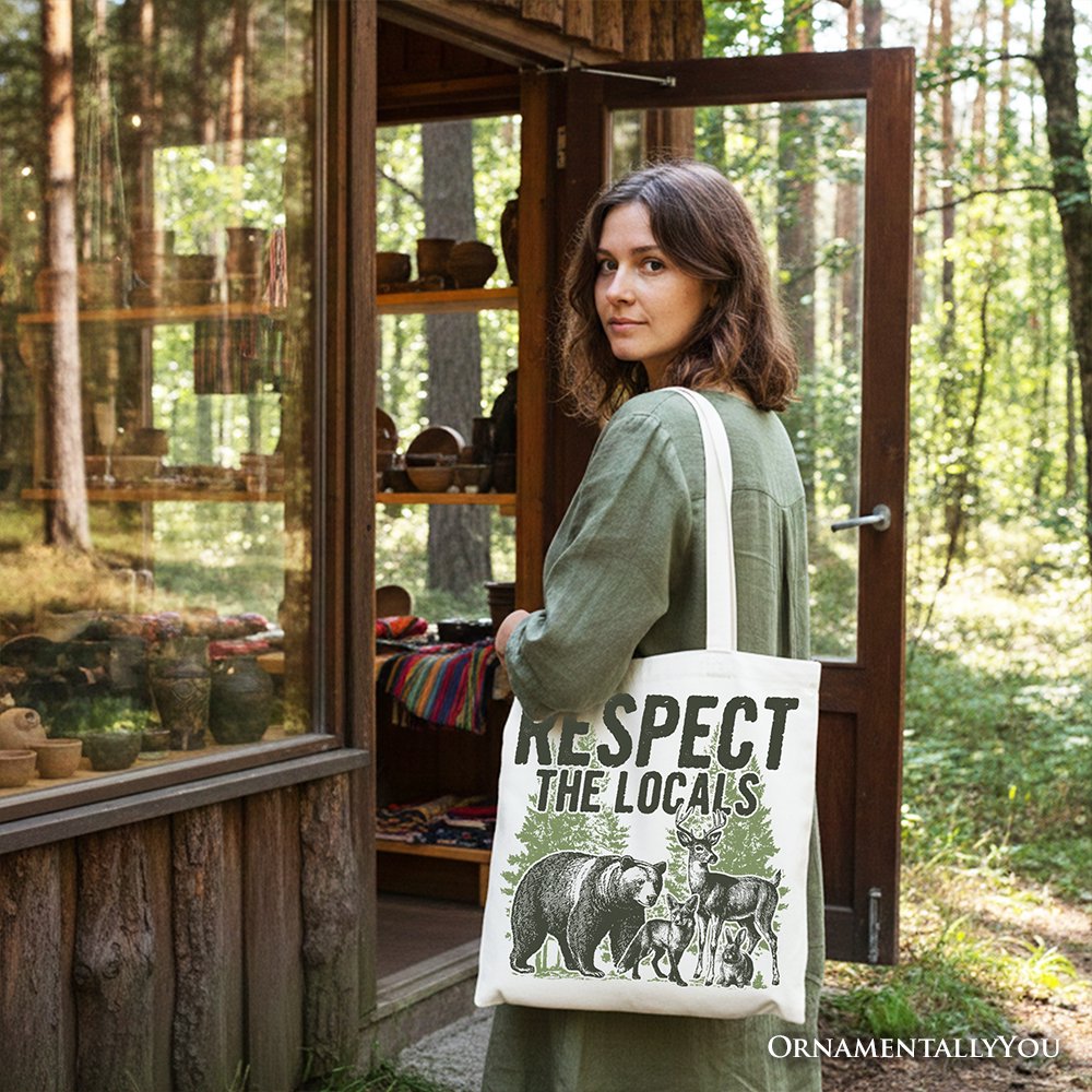 White canvas tote bag with black handles, 'Respect the Locals' animal front print.