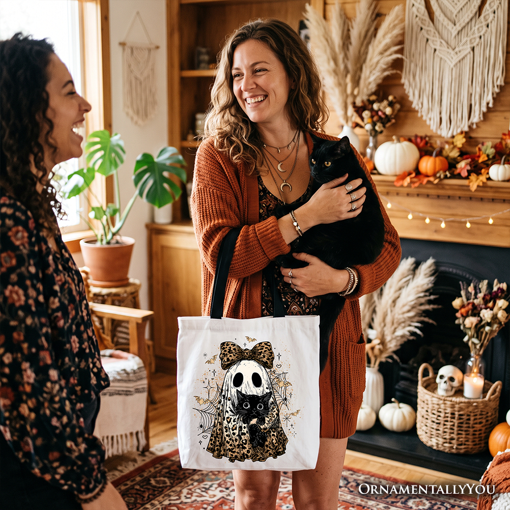 Cotton tote bag with white fabric and black handles, featuring ghost cat and leopard bow