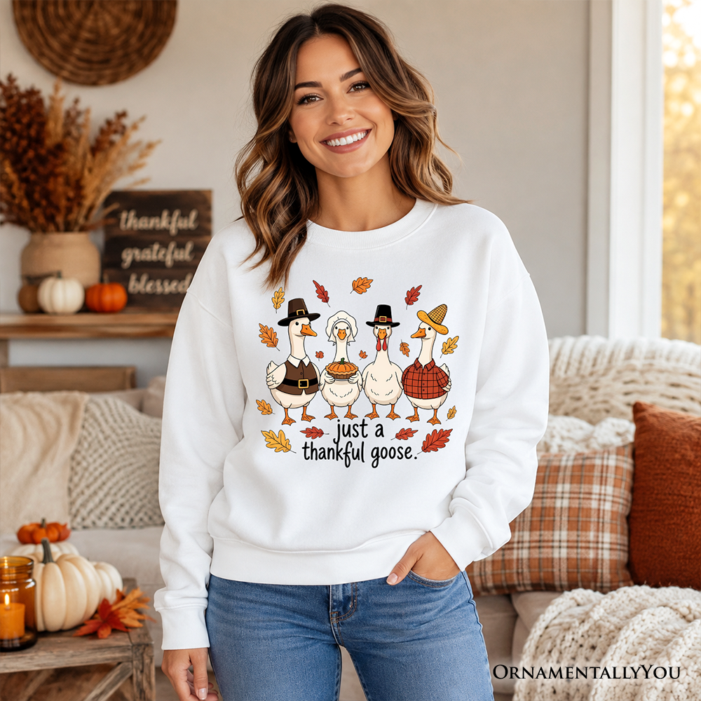 White crewneck sweatshirt with Thanksgiving geese graphic and "just a thankful goose" text