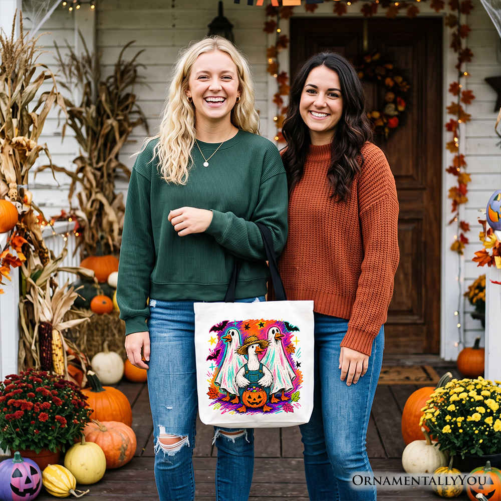 White tote bag with colorful goose family print and teal pumpkin center.