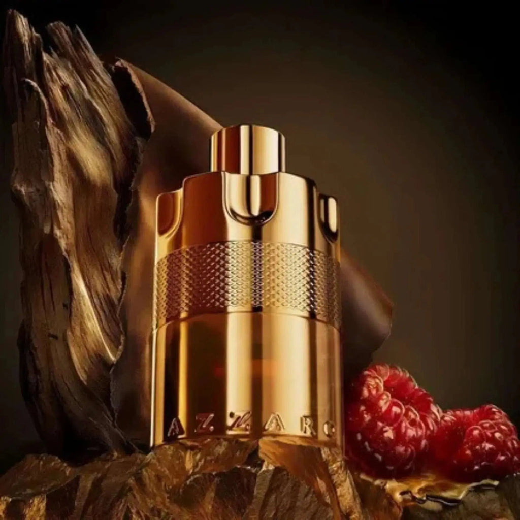 Gold cylindrical perfume bottle with ribbed spray cap and textured middle band