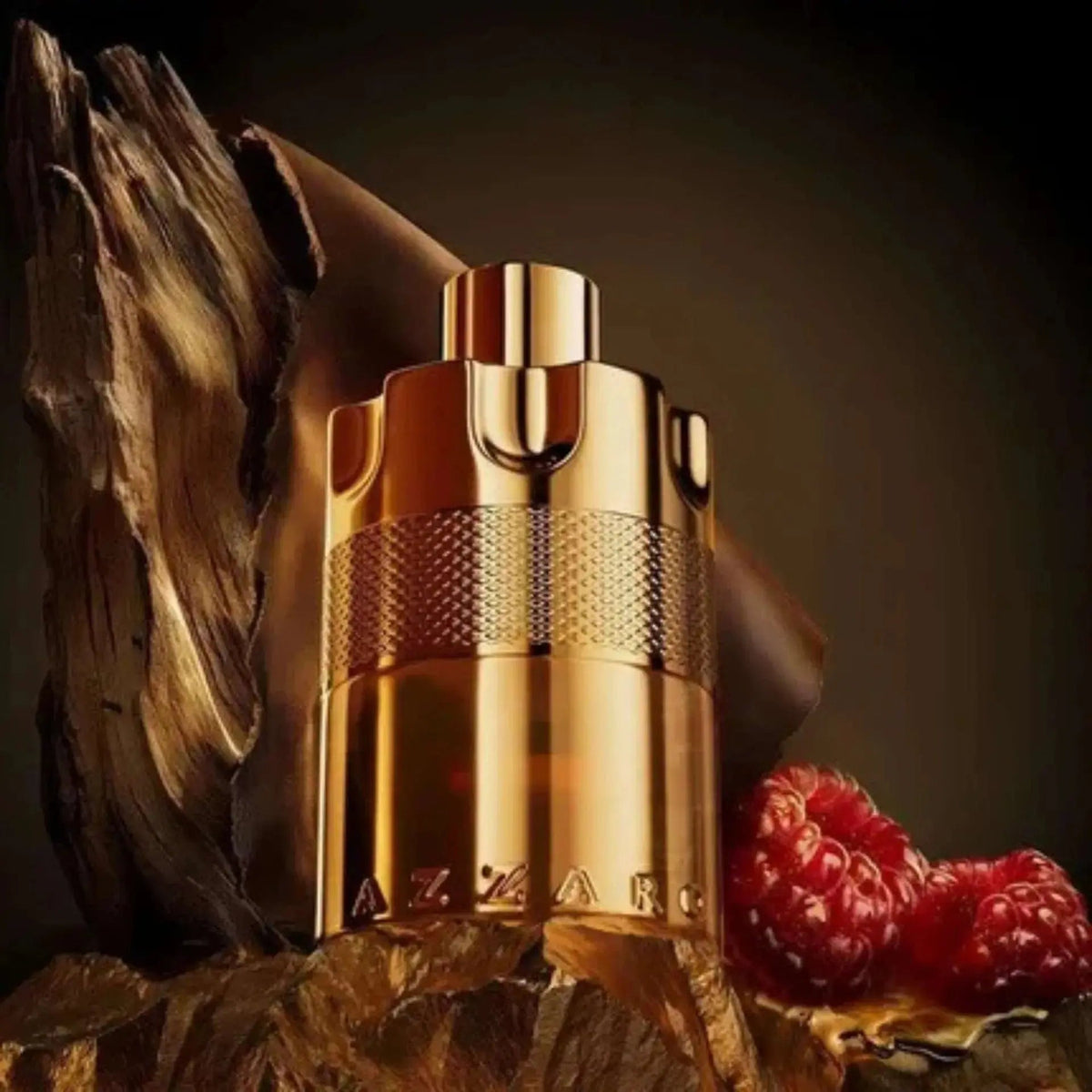 Gold cylindrical perfume bottle with ribbed spray cap and textured middle band