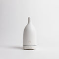 White ultrasonic essential oil diffuser with teardrop shape and mist vents