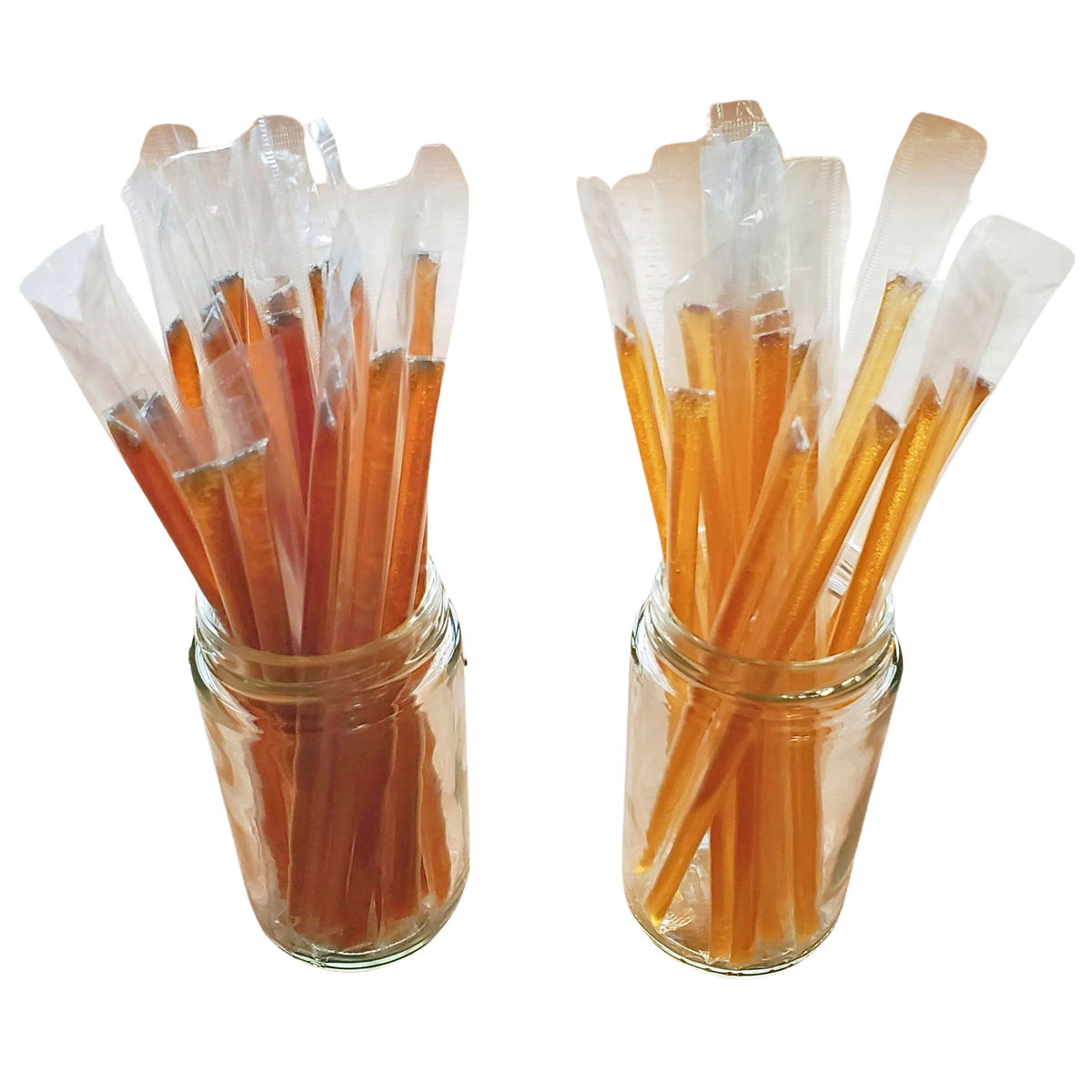 Honey sticks in amber and orange tones, bundled with clear wrappers