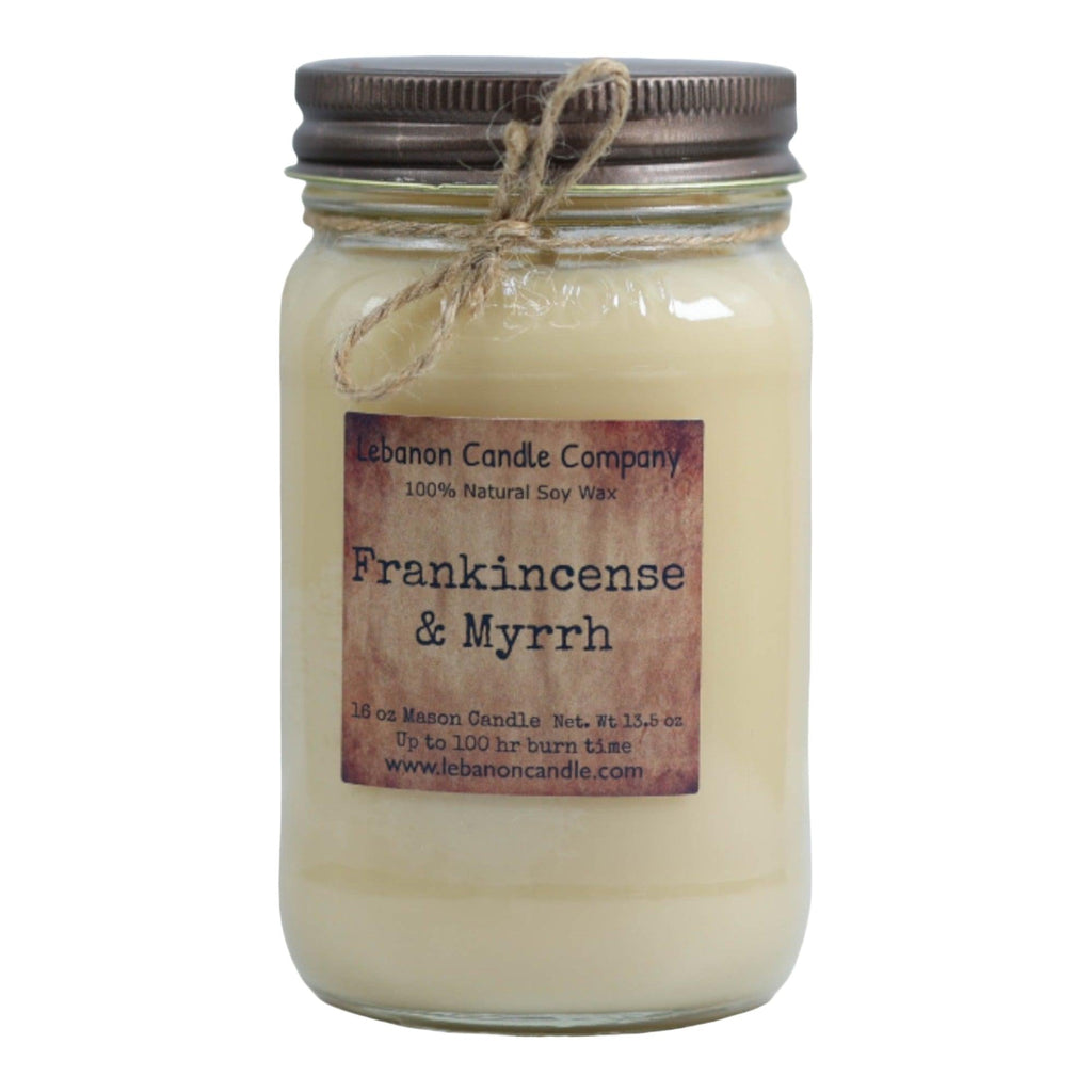 Soy candle in clear glass jar with twine bow and Frankincense & Myrrh label