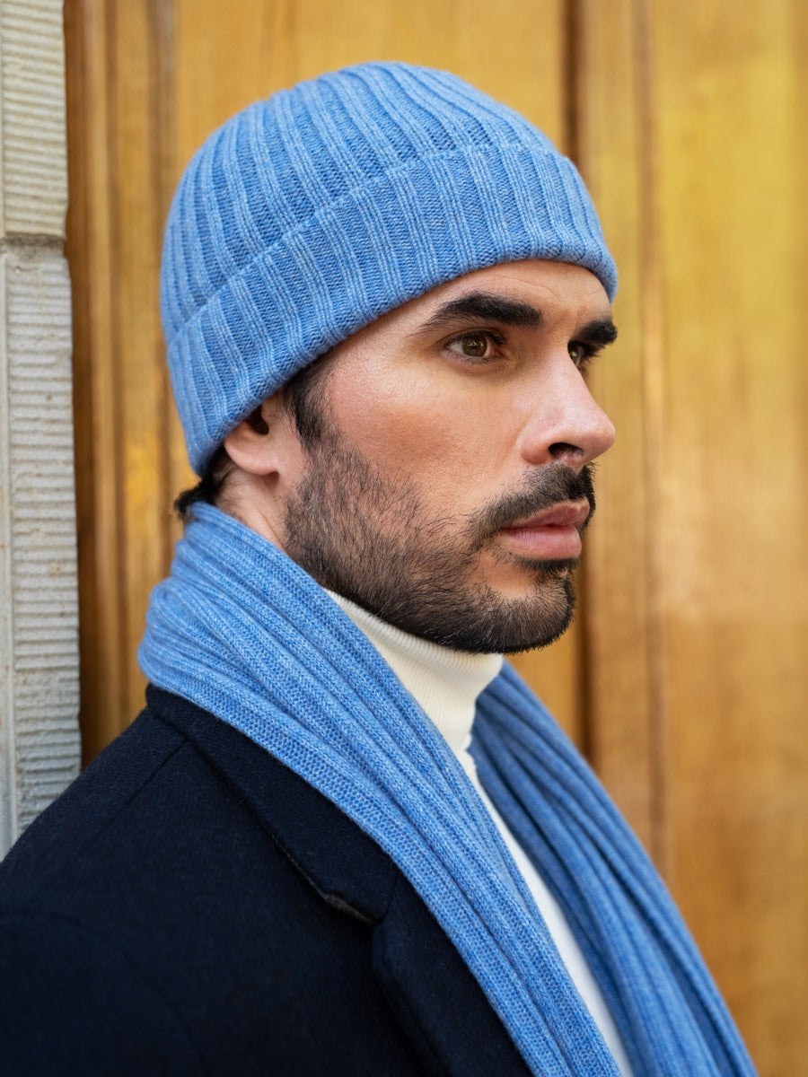 Light blue ribbed beanie with matching scarf at side, close-up