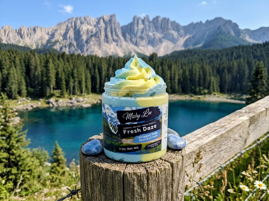 Whipped soap and shave cream jar with blue and yellow swirl topping on a wooden log