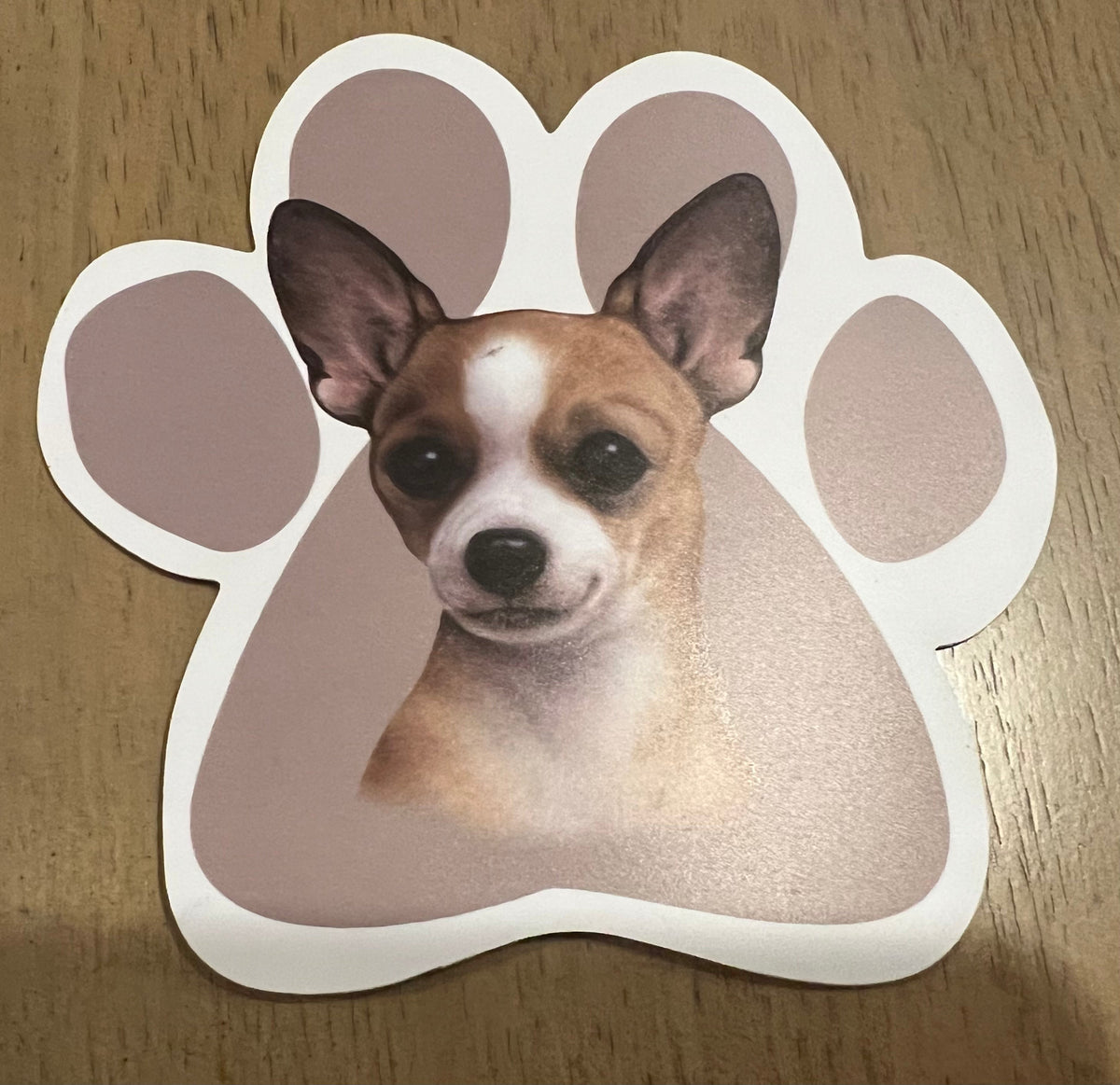Tan Chihuahua paw-shaped car magnet with dog face illustration