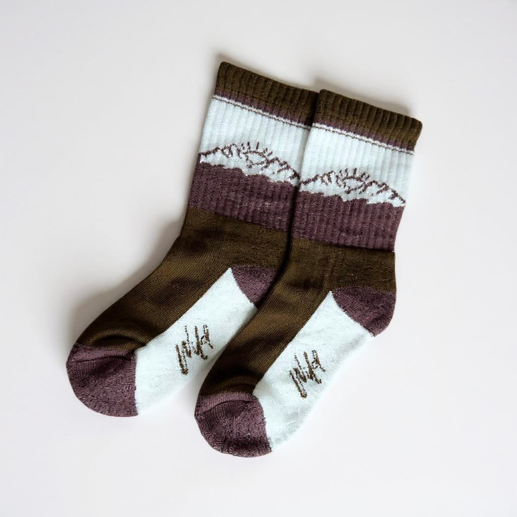 Kids' boot socks in dark brown with maroon cuffs and white graphic stripes